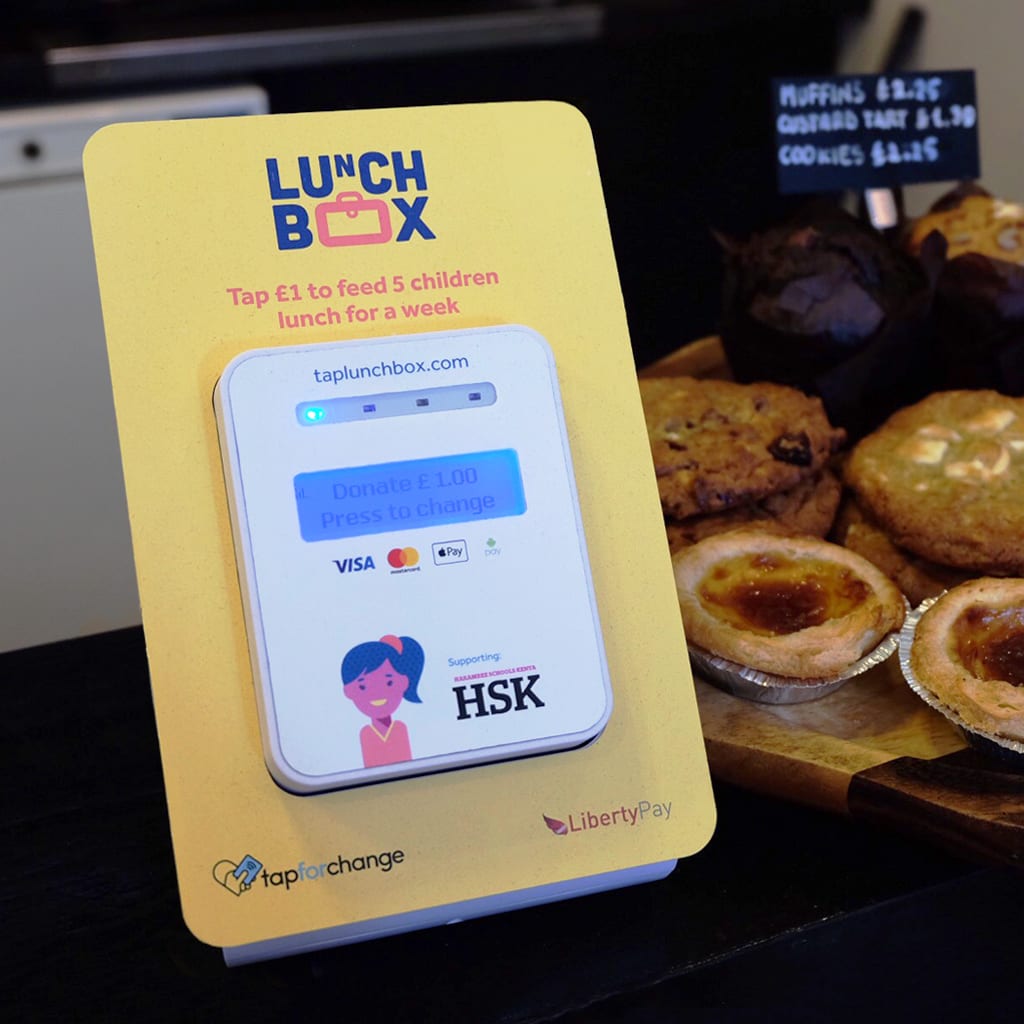 ‘Lunchbox‘ donations box on the counter at a London coffee shop, using Tap for Change contactless technology